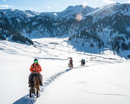 Horseback riding with skis in the mountains of Tian Shan