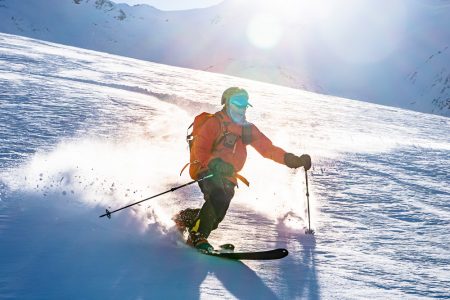 A happy telemark skier enjoying the slopes of Jyrgalan, Kyrgyzstan