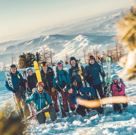 Happy skiers in a private group