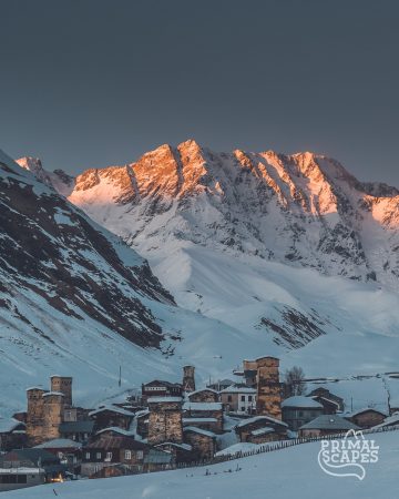 Sunset in Ushguli village in winter with Europe's third tallest peak Shkhara in the backdrop